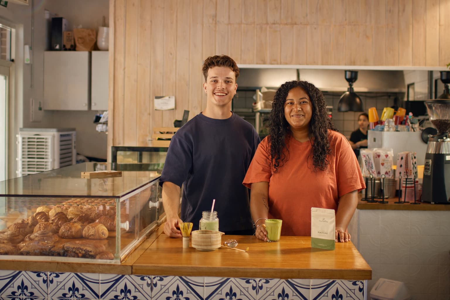 Cafe staff serving MatchaFlow matcha