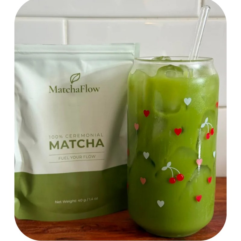 MatchaFlow ceremonial matcha pouch beside an iced matcha