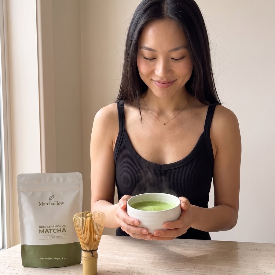 Woman holding a bowl of whisked MatchaFlow Ceremonial matcha